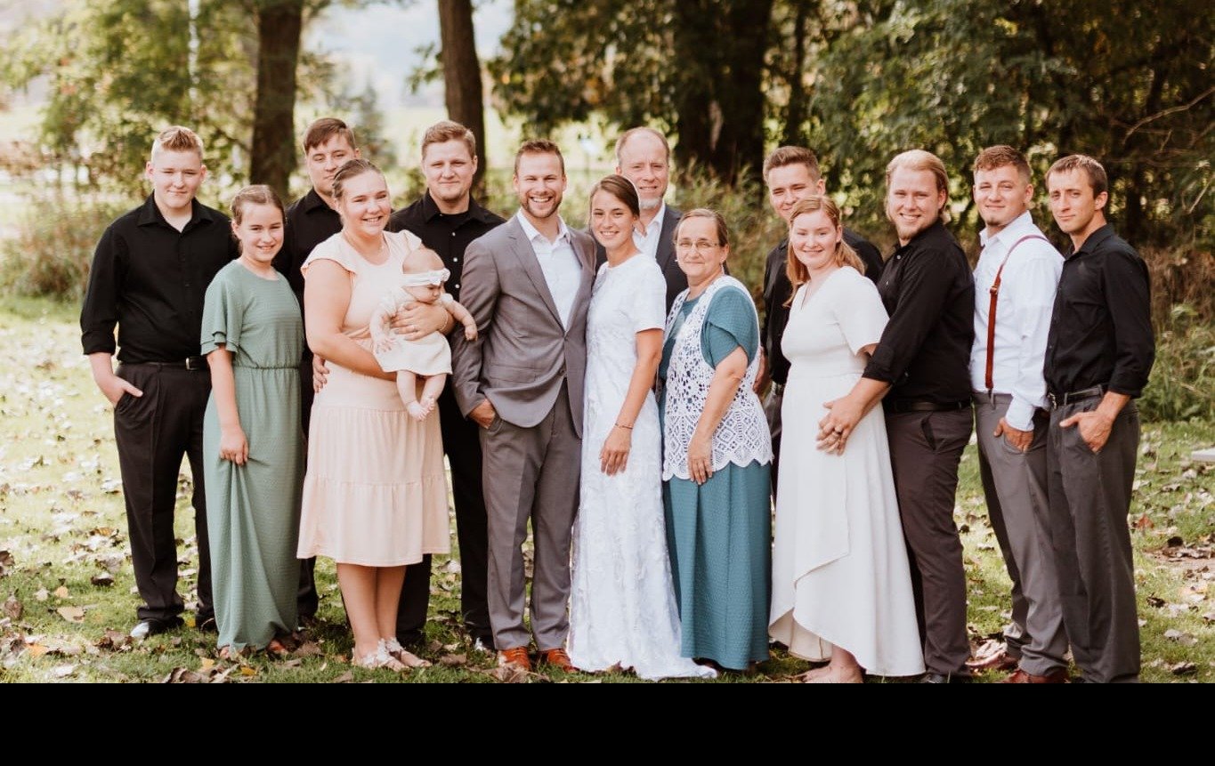 The Grazin' Acres family &mdash; a large multi-generational family portrait outdoors among the trees